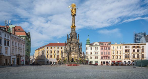Panorama of Olomouc, Czech Republic at sunset. The Square and the Holy Trinity Column enlisted in the Unesco world heritage list and Astronomical clock in the building of the Town Hall
