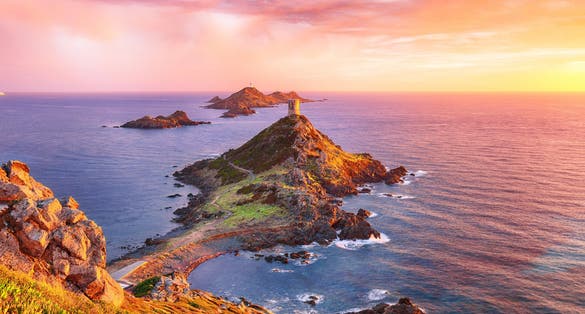 Photo of sunset over popular tourist destination Torra di a Parata with Genoese Tower, Ajaccio commune.
