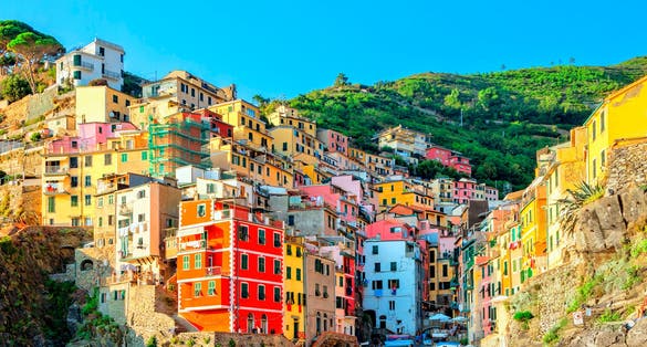 photo of view of Riomaggiore is a village in the province of La Spezia, Liguria, Cinque Terre Coast of Italy. Riomaggiore one of five famous colorful villages of Cinque Terre National Park in Italy. Landmark of Italy,Riomaggiore italy.