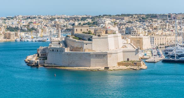 Photo of aerial view of Fort Saint Angelo of Birgu in Malta from the sea.