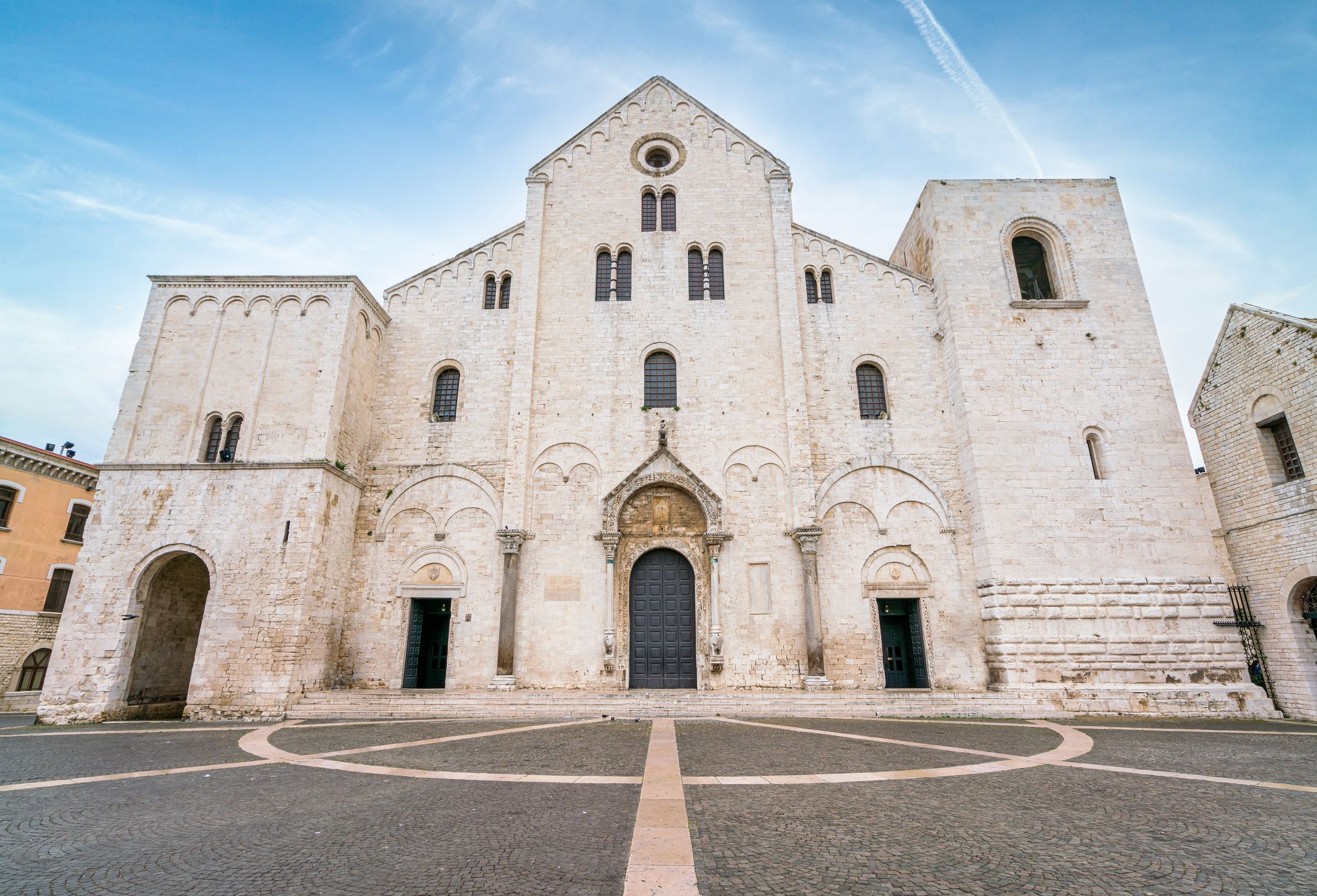 photo of Saint Nicholas Basilica (Basilica di San Nicola) in old town Bari. Apulia (Puglia), Italy.
