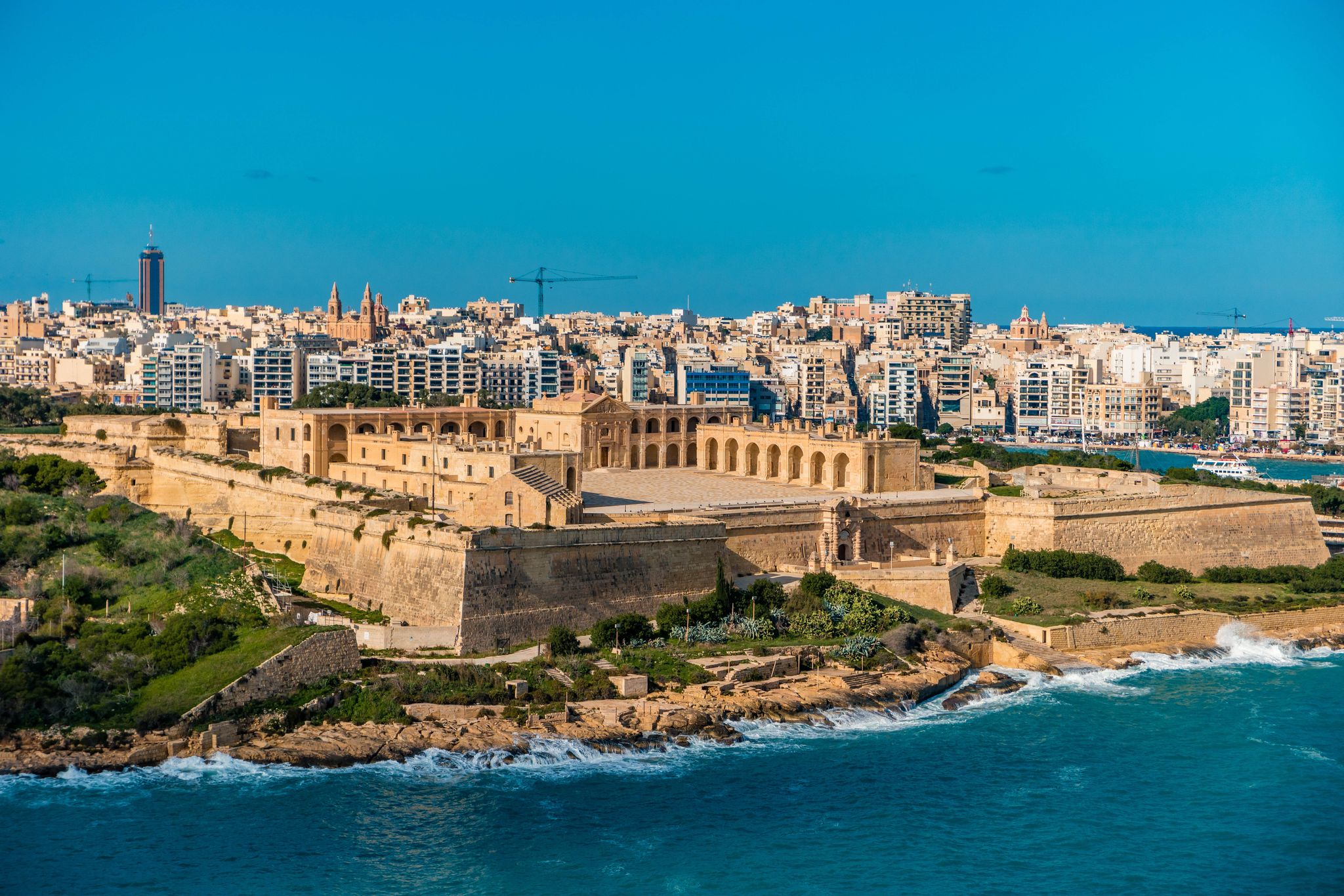 Photo of aerial view of Fort Saint Angelo of Birgu in Malta from the sea.