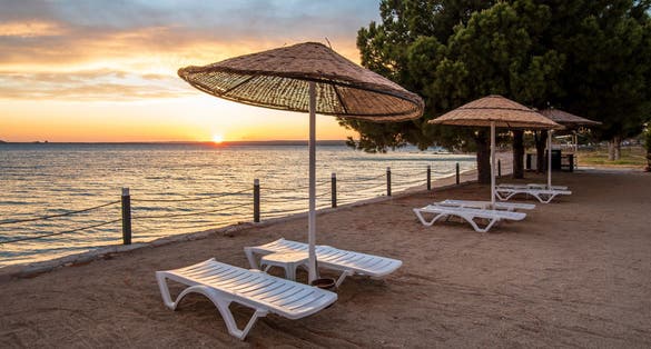Photo of beautiful sunset at Bozbuk beach in Didim of Turkey.