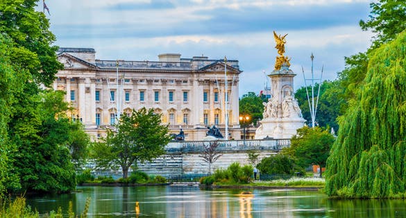 Photo of Buckingham Palace seen from St. James Park in London, UK.