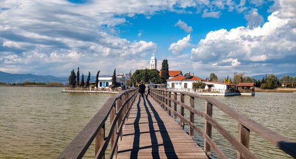 photo of the Monastery of Agios Nikolaos in Vistonida Lake. The aquatic biotope of lake, hosts more than 200 species of wild birds spend the wintertime in this area. Xanthi Prefecture. Greece.