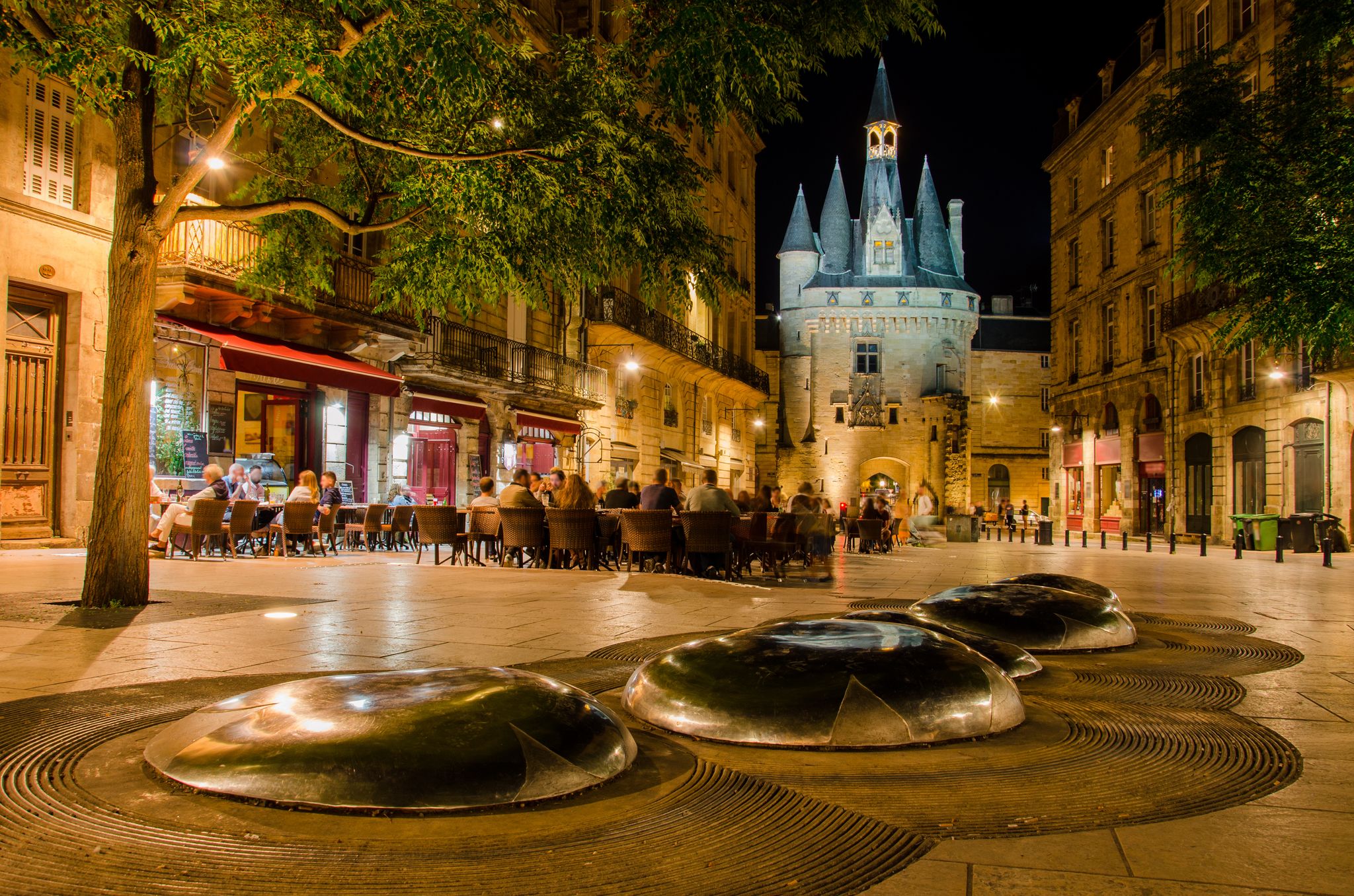 photo of "Place du Palais" by night with "Porte Cailhau" background from Bordeaux in France.