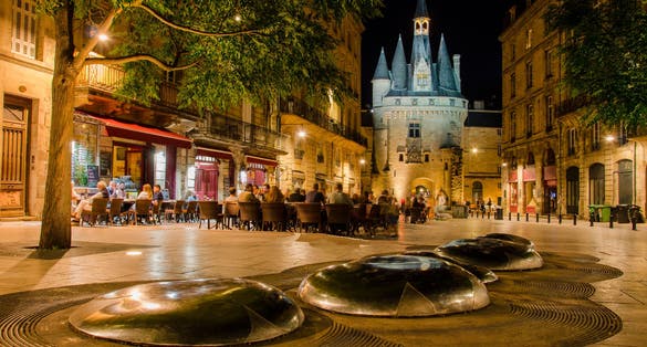 photo of "Place du Palais" by night with "Porte Cailhau" background from Bordeaux in France.