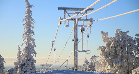 Winter in finish Lapland behind the polar circle. Snow shoe hike on the Keski-Luosto hill near of Sodankylä in the Pyhä-Luosto National Park. At the hill station of the ski lift.