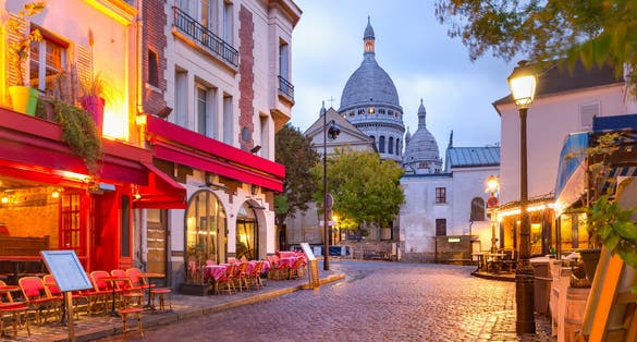 The Place du Tertre with tables of cafe and the Sacre-Coeur in the morning, quarter Montmartre in Paris, France