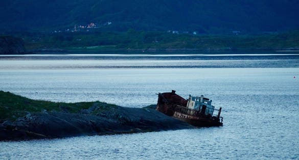 photo of view of A shipwreck near the Atlantic Ocean Road between Molde and Kristiansund, Norway.