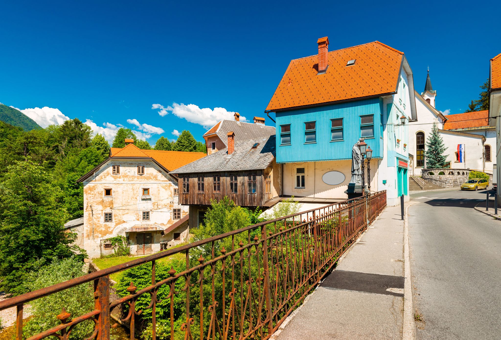 Photo of Amazing view of the medieval city on Capuchin Bridge in Slovenia.