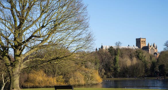 Photo of the magnificent St. Albans Cathedral viewed from Verulamium Park in the historic city of St. Albans, England.