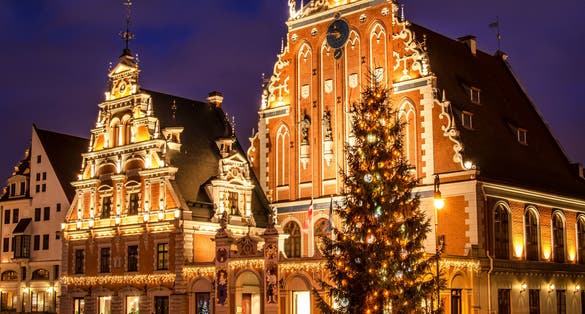 Photo of house of the Blackheads with Christmas tree at night, old town Riga, Latvia.