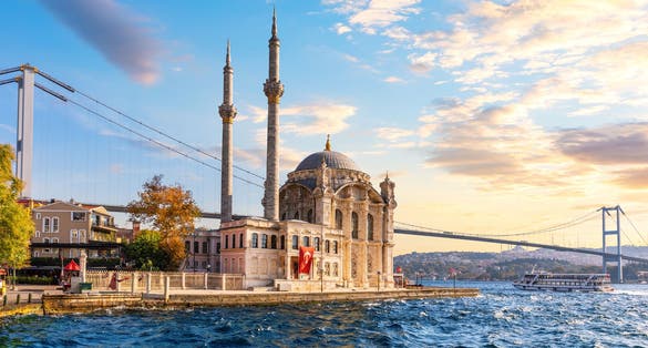 Photo of Bosphorus Bridge and the Ortakoy Mosque at sunset, Istanbul, Turkey.