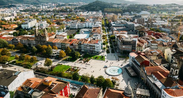Aerial view of Barcelos city, district Braga, Portugal. Landscape on the river Cavado, Barcelos bridge, Paco dos Condes, water mill and church.