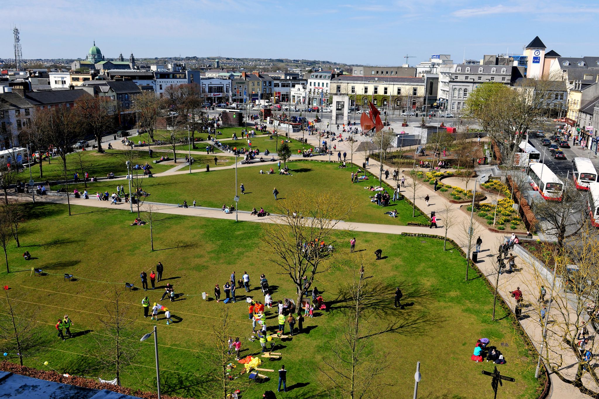 Photo of aerial view of Eyre Square, Galway City on a quiet summer morning showing the surrounding flora and buildings.