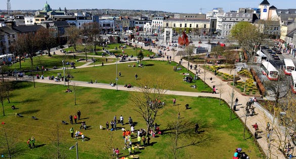 Photo of aerial view of Eyre Square, Galway City on a quiet summer morning showing the surrounding flora and buildings.