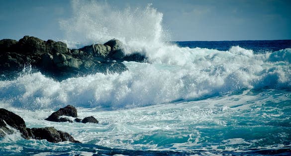 Waves of water of the river and the sea meet each other during high tide and low tide. Whirlpools of the maelstrom of Saltstraumen, Nordland, Norway