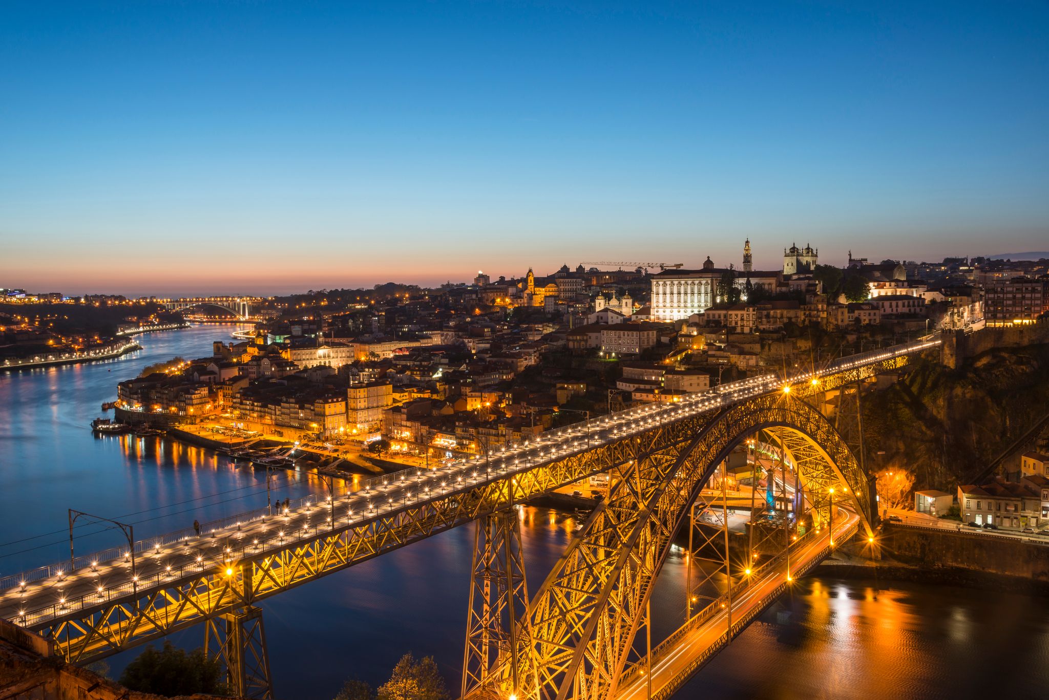 View of Douro River in dusk. Dom Luis Bridge at the night. Porto, Portugal.