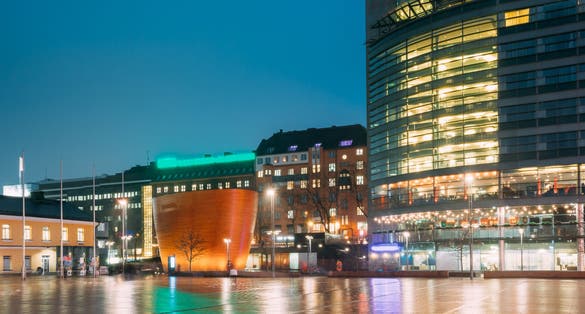 Photo of Kamppi Chapel Also Known As Chapel Of Silence at night Located On Narinkka Square, Helsinki, Finland.