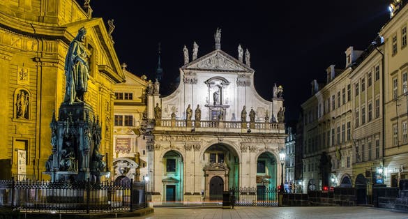 Photo of night view of Crusaders church and Clementinum in Prague, Czech republic.