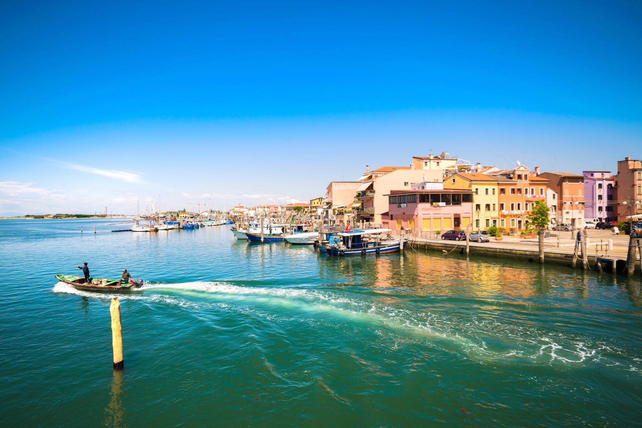 Photo of Aerial view of the white tall apartment buildings of the coast of Chioggia in Italy.