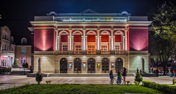 night view over building of bulgarian national opera house in rousse - ruse.