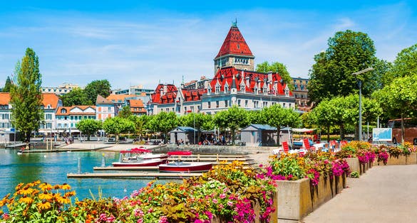 Photo of Geneva lake promenade near the Chateau Ouchy Castle, Switzerland.