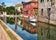 حاخفخ خب رهثص خبTorcello, Venice. Colorful houses on Torcello island, canal and boats. Summer, Italyز