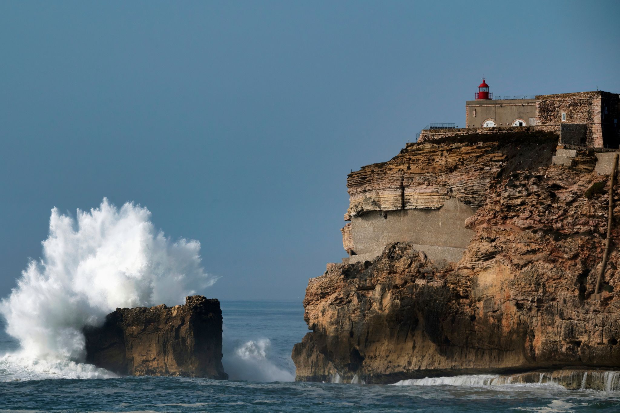 Nazaré lighthouse in Portugal with Big waves