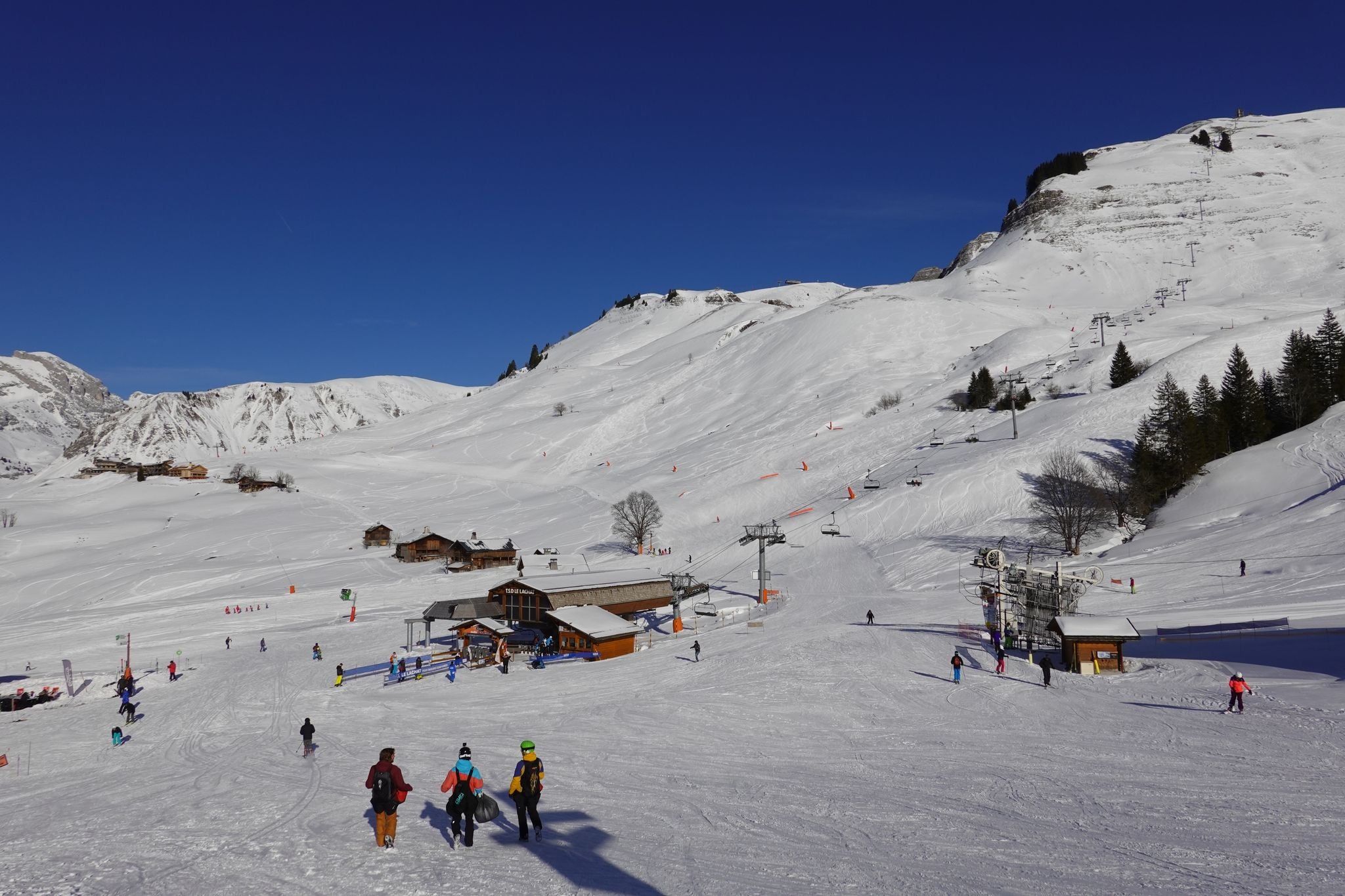 photo of Annecy city center panoramic aerial view with the old town, castle, Thiou river and mountains surrounding the lake, beautiful summer vacation tourism destination in France, Europe.