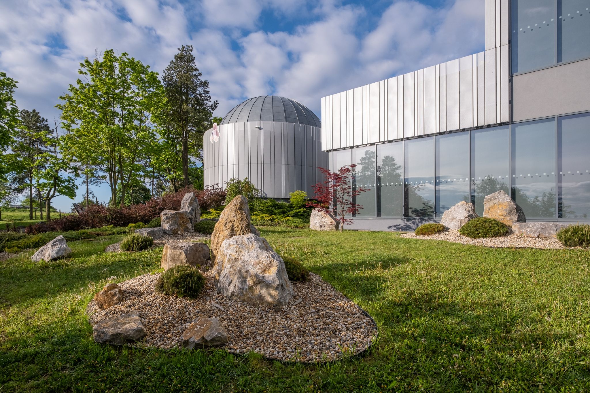 Photo of Brno Observatory and Planetarium with nice rock garden, Czechia.