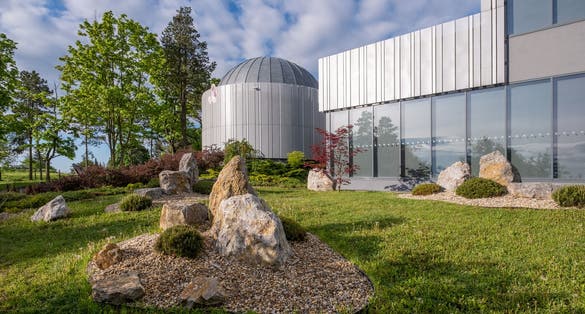 Photo of Brno Observatory and Planetarium with nice rock garden, Czechia.