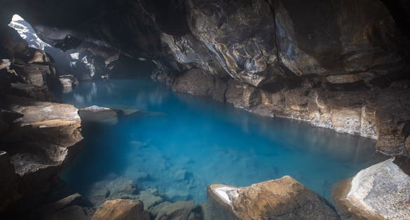 photo of view of Grjotagja natural hot spring in a volcanic cave near Reykjahlid, Lake Myvatn Region, Iceland.