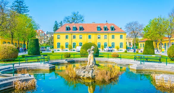 Photo of a yellow pavillion in the Schonbrunn tiergarten zoological garden in Vienna, Austria.
