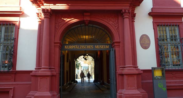 Entrance of Baroque style buidling of Electoral Palatinate Museum called 'kurpfalzisches Museum' in German with golden letters.