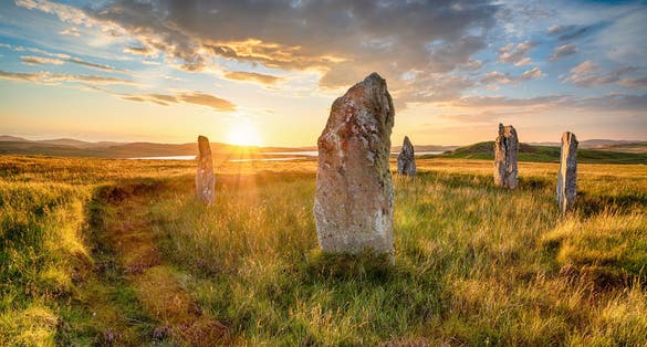 photo of Dramatic sunset over Ceann Hulavig stone circle on the Isle of Lewis in  Stornoway ,the out Hebrides of Scotland, also known as Callanish 4.