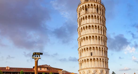 photo of medieval leaning tower of pisa (Torre di pisa) at piazza dei miracoli (Piazza del duomo), Tuscany, Italy.