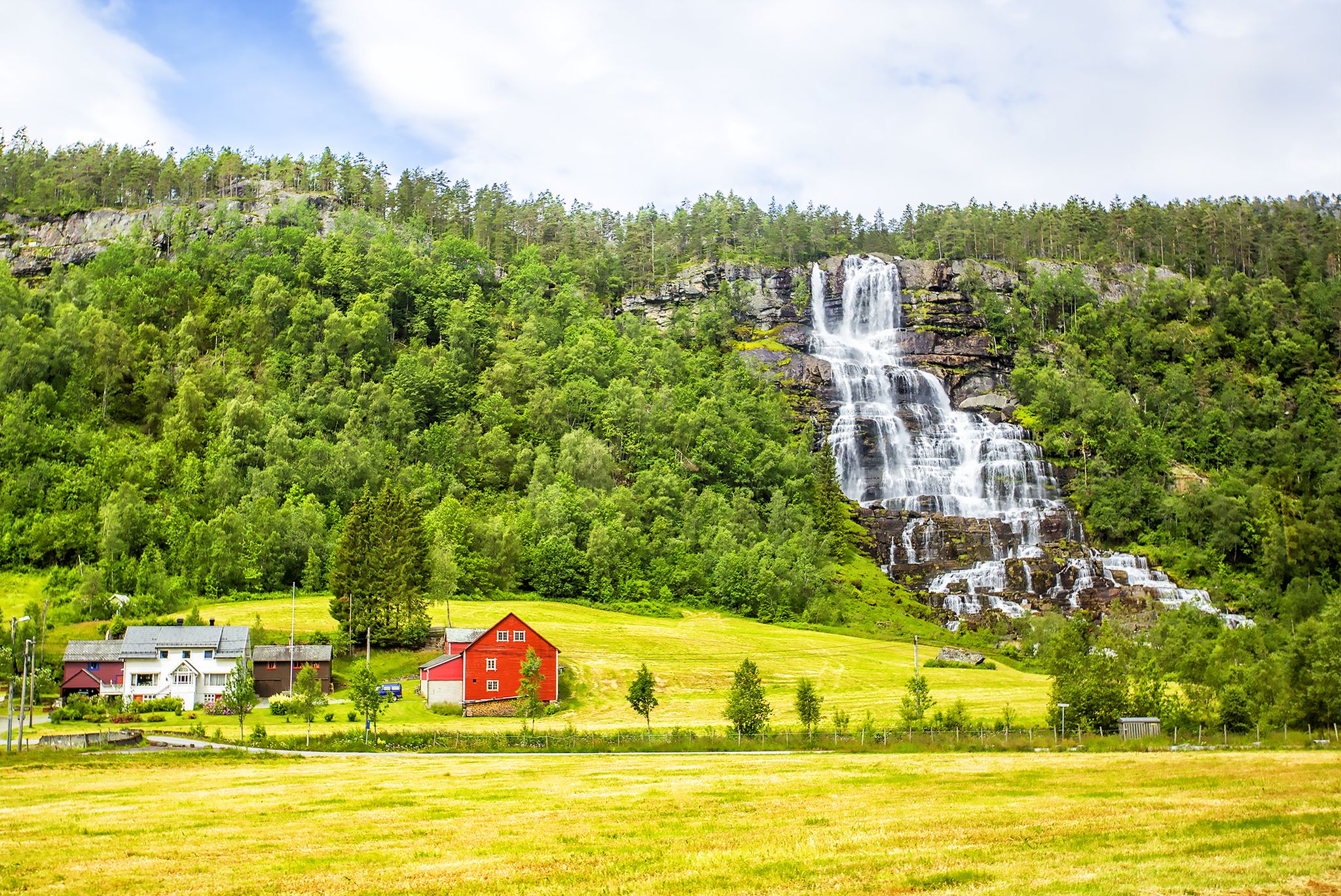 Waterfall Tvindefossen, Norway. Waterfall Tvindefossen is the largest and highest waterfall of Norway, it is famous for its beauty, its height is 152 m.