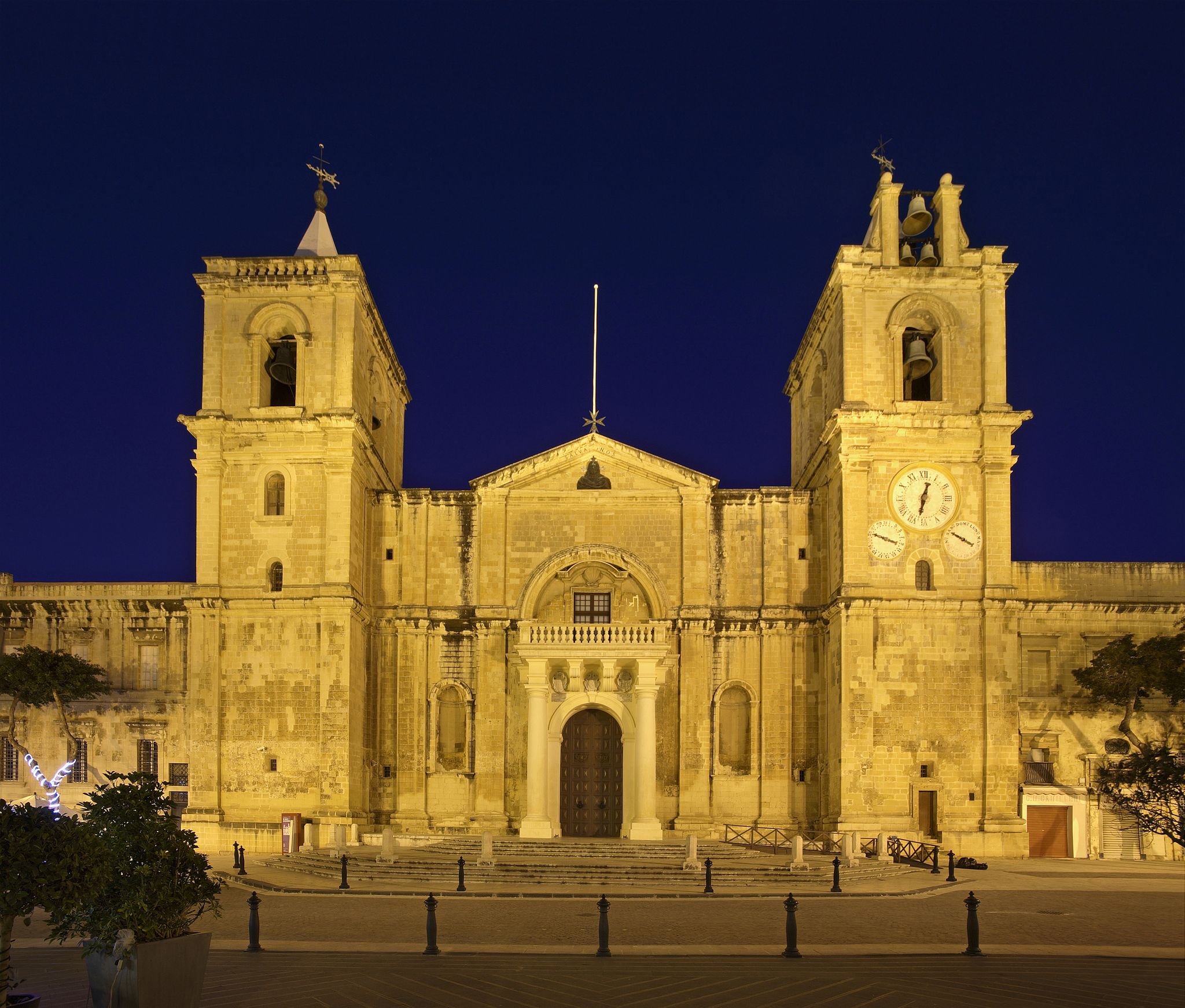 Photo of exterior view of Saint John's Co-Cathedral at night in Valletta, Malta.