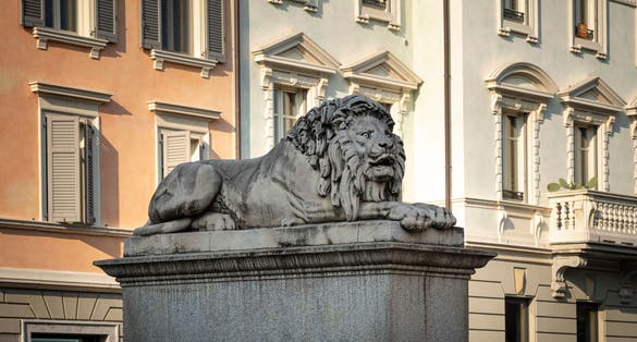 Statue of one of the two Lions placed on the pylons of the "Ponte dei Leoni", in the city center of Monza (Italy)
