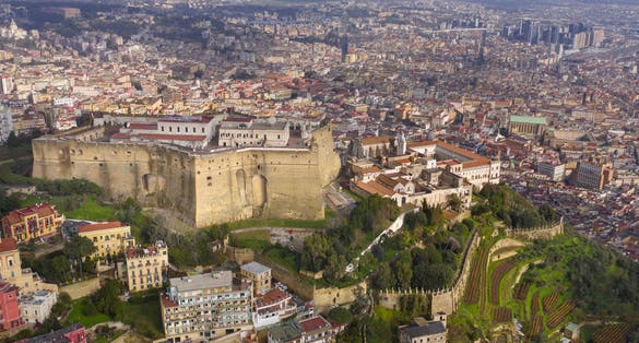 Aerial view of Castel Sant'elmo in Naples, Italy. The Castle is located in the Vomero district and overlooks the town. In background the downtown of the city.