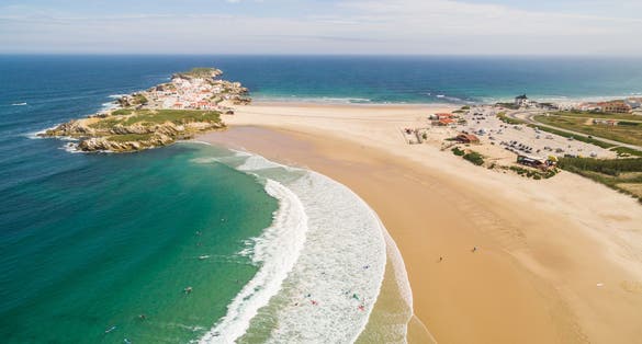 Photo of Praia do Campismo and Island Baleal naer Peniche on the shore of the ocean in west coast of Portugal.