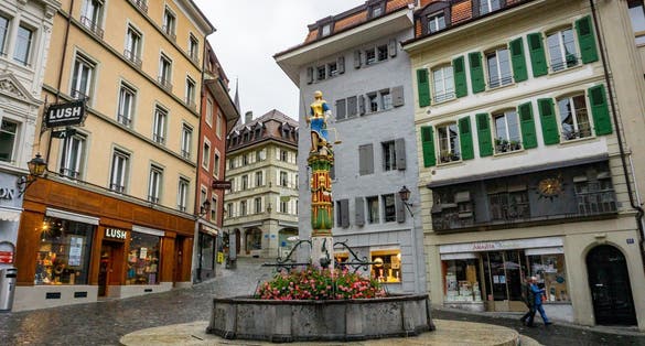 photo of Fountain of Justice (Fontaine de la Justice) at Place de la Palud in Lausanne, Switzerland.