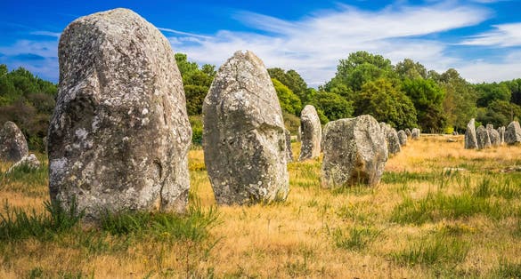 photo of The Carnac stones are an exceptionally dense collection of megalithic sites in Le Ménec, France.