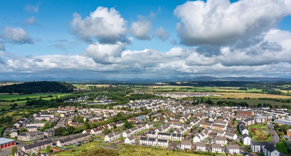 Photo of Aerial view of the city of Stirling at the foot of the medieval castle located on a hill, Scotland.
