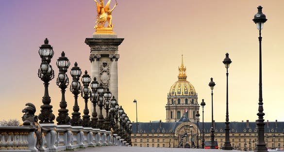 Beautiful sunrise at the Pont Alexandre III and Les Invalides in Paris