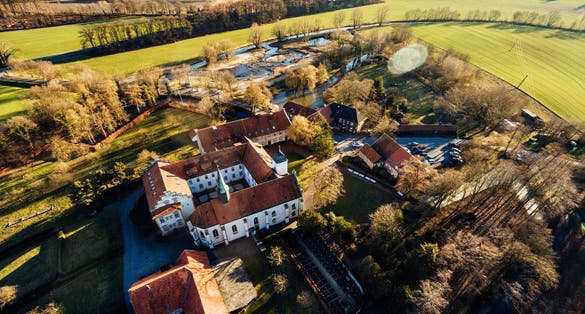 Photo of Aerial view on the monastery of Kloster Vinnenberg, a popular landmark and tourist site in Warendorf, Münsterland, Westfalia, Germany.