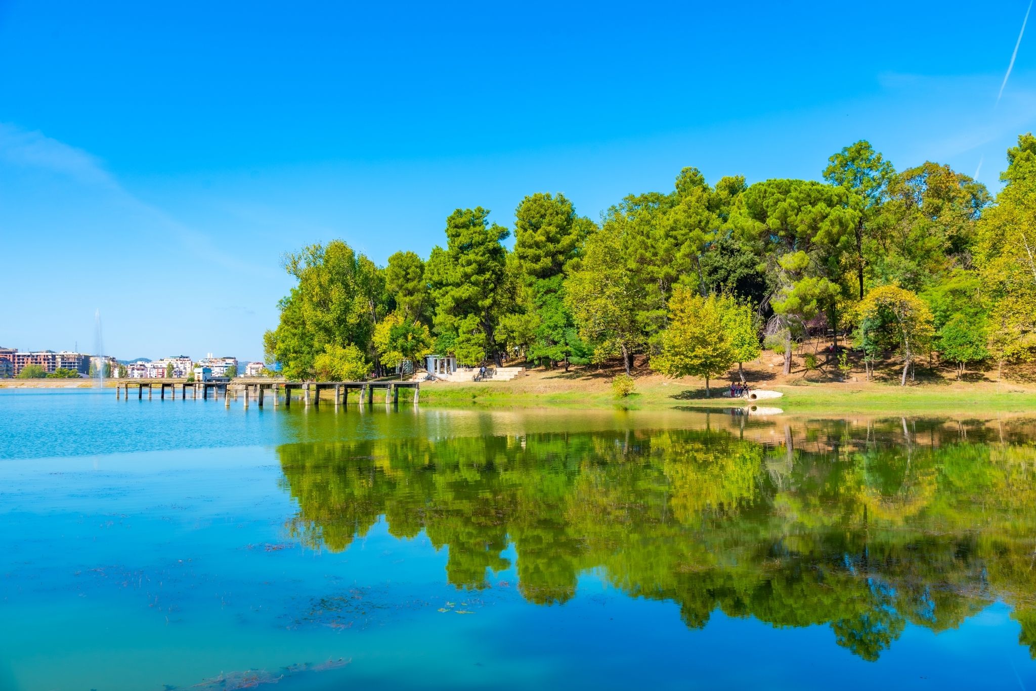 Photo of grand park in Tirana behind an artificial lake, Albania.