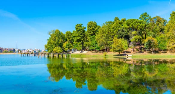 Photo of grand park in Tirana behind an artificial lake, Albania.